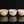 Load image into Gallery viewer, Three ceramic cups with floral patterns on a black background
