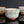 Load image into Gallery viewer, Three ceramic cups with floral patterns on a reflective surface and dark background
