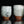 Load image into Gallery viewer, Two ceramic cups with a textured surface on a black background

