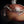 Load image into Gallery viewer, Close-up of a brown ceramic object with white accents on a black background
