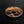 將圖片載入到圖庫檢視器中， A round ceramic plate with a glossy black glaze, featuring a copper-orange branch-like pattern and fine speckling on the interior, set against a solid black background.
