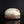 Load image into Gallery viewer, A handmade ceramic lidded box with a textured, organic-shaped cream and brown glazed top and a rustic dark brown base, displayed on a reflective black surface against a black background.
