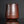 Load image into Gallery viewer, Brown ceramic cup on a reflective surface with a dark background
