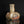 將圖片載入到圖庫檢視器中， A rustic ceramic vase with a bulbous, organic base and a narrow neck, featuring a textured glaze in earthy tones of brown, beige, and reddish accents, set against a solid black background with a reflection below.
