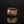 Load image into Gallery viewer, Brown ceramic cup on a black reflective surface
