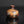 Load image into Gallery viewer, Small ceramic jar with brown and black glaze on a reflective black surface
