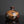 Load image into Gallery viewer, Brown ceramic vase on a reflective surface with a dark background
