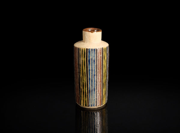 Cylindrical ceramic sake bottle with striped pattern on a black background
