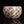 Load image into Gallery viewer, Decorative ceramic bowl with floral design on a black background
