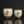 將圖片載入到圖庫檢視器中， Two ceramic cups with decorative designs on a reflective surface.

