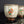將圖片載入到圖庫檢視器中， Two ceramic cups with decorative designs on a reflective surface.
