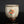 Load image into Gallery viewer, Ceramic cup with textured surface and colorful design on a dark background
