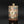 將圖片載入到圖庫檢視器中， A distinctive square jar by Tatsuzo Shimaoka, combining a firm architectural form with bands of inlaid decoration and colourful floral roundels. Its cream, muted blue and pinkish-brown palette brings warmth to the straight-sided body, while the patterned surfaces reflect the artist’s inventive approach to Mashiko pottery.

The tall rectangular body rises to a broad, nearly flat shoulder and a short cylindrical neck. A gently flaring lip softens the transition between the angular vessel and its circular open

