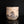 將圖片載入到圖庫檢視器中， A handmade ceramic canister with a lid, featuring a textured beige body decorated with a black and brown painted motif, set against a solid black background with a reflection below.
