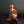 Load image into Gallery viewer, A sculptural monkey-shaped incense burner by Tsuda Eiju, distinguished by its upright seated pose and smoothly modelled brown surface. The animal raises its face, creating a lively expression while retaining the compact, self-contained outline of a small metal sculpture.

The rounded body rests on its haunches, with long forelimbs descending towards the base. A broad oval area defines the flank, introducing a shallow change in contour against the curved torso. The head is carefully simplified, with projecti
