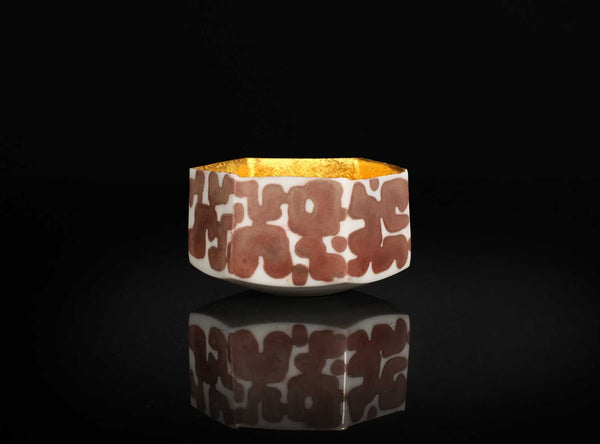 A Gilt Decorated Guinomi with a geometric pattern on a black background