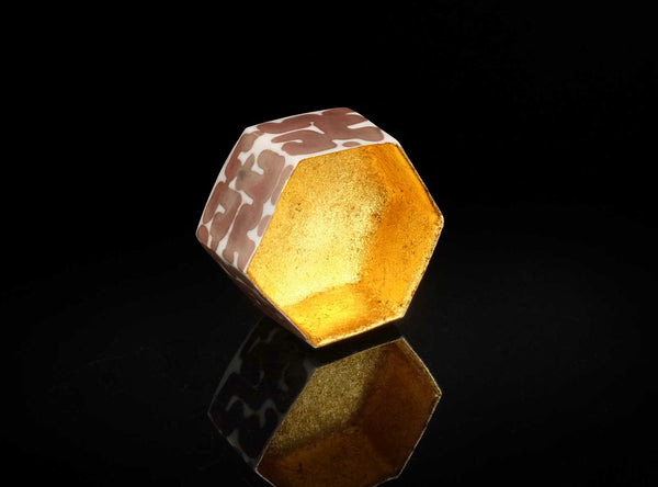 A Gilt Decorated Guinomi with a geometric pattern on a black background