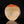 將圖片載入到圖庫檢視器中， A polished natural stone sculpture with a hagi ensai flattened vase, disc-like shape, featuring a color gradient from warm orange-red at the top to light beige and cream at the bottom, displayed on a reflective black surface against a solid black background.
