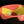 將圖片載入到圖庫檢視器中， Close-up of a red and yellow object with a black background

