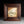 Load image into Gallery viewer, Framed artwork of a white flower with green leaves on a gold background
