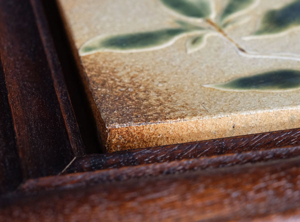 Close-up of a wooden frame with a textured surface